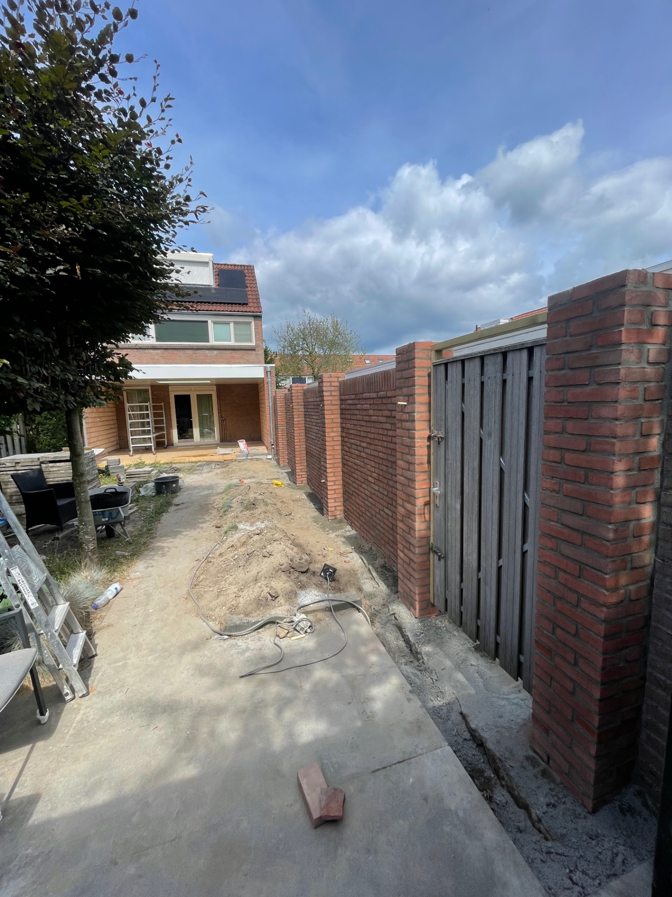Aanbouw en tuinmuur – foto 9